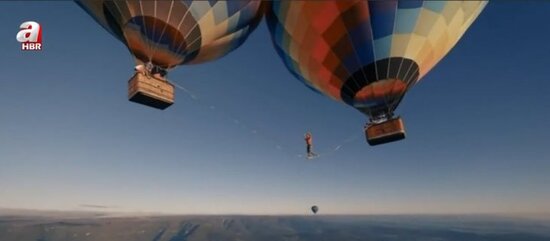 Səmada ADRENALİN: İki şar arasına ip keçirdi və... - FOTO