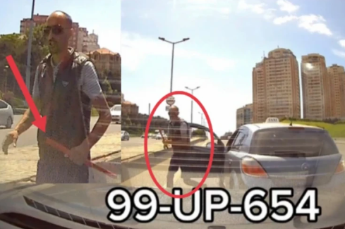 Taksi sürücüsü taxta ilə xanım sürücüyə hücum etdi - VİDEO