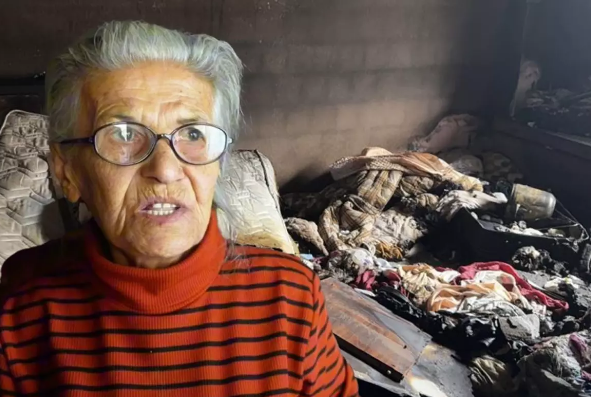 Anasını balta ilə kəsmək istədi, bacarmadığı üçün evi yandırdı - VİDEO