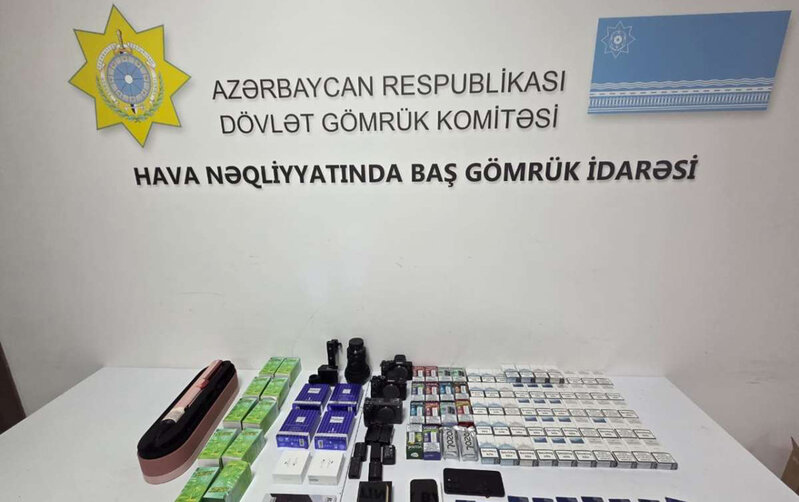 Bakıya gələrkən ayaqqablarından da, telefonundan da qızıl çıxdı - Fotolar