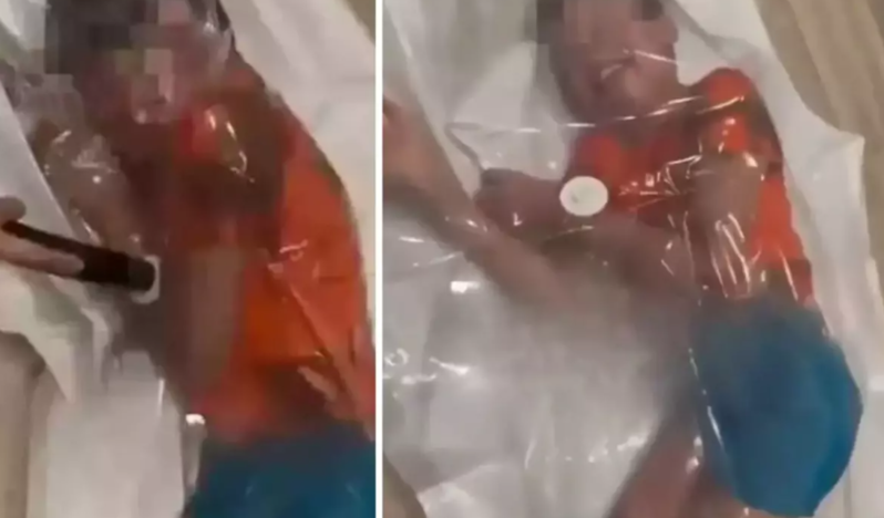 Ana sosial şəbəkədə "bəyənmə" xətrinə oğlunu vakuumlu torbaya saldı - VİDEO